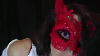 Hot brunette in a sexy mask worships dog dick and more