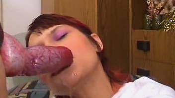 Redheaded lady getting sloppy as fuck with a red dong
