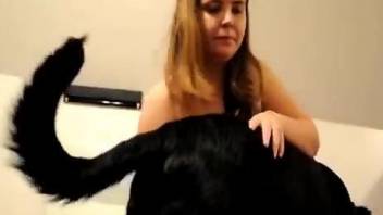 Fine gal sucks the dog's dick in extra sloppy modes while on cam