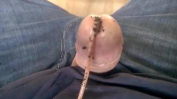 Man jerks off with worms in his dick while still wearing his jeans