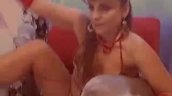 Attractive lady is fondling herself and her pet dog