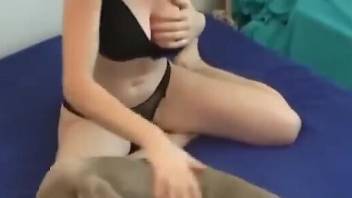 Big boobies babe is going to get tit-fucked by a dog