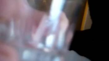 Man sticks his dick into a glass full with insects